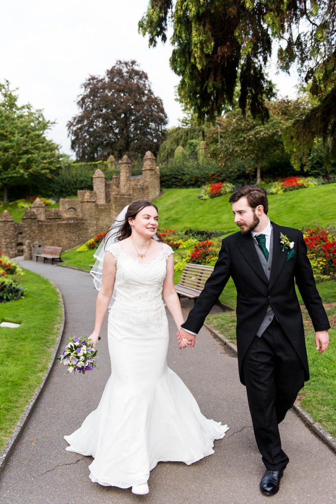 Couple walk through Guildford Castle gardens together