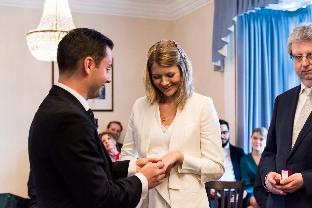 Natural wedding photographer Surrey - the moment the rings are exchanged