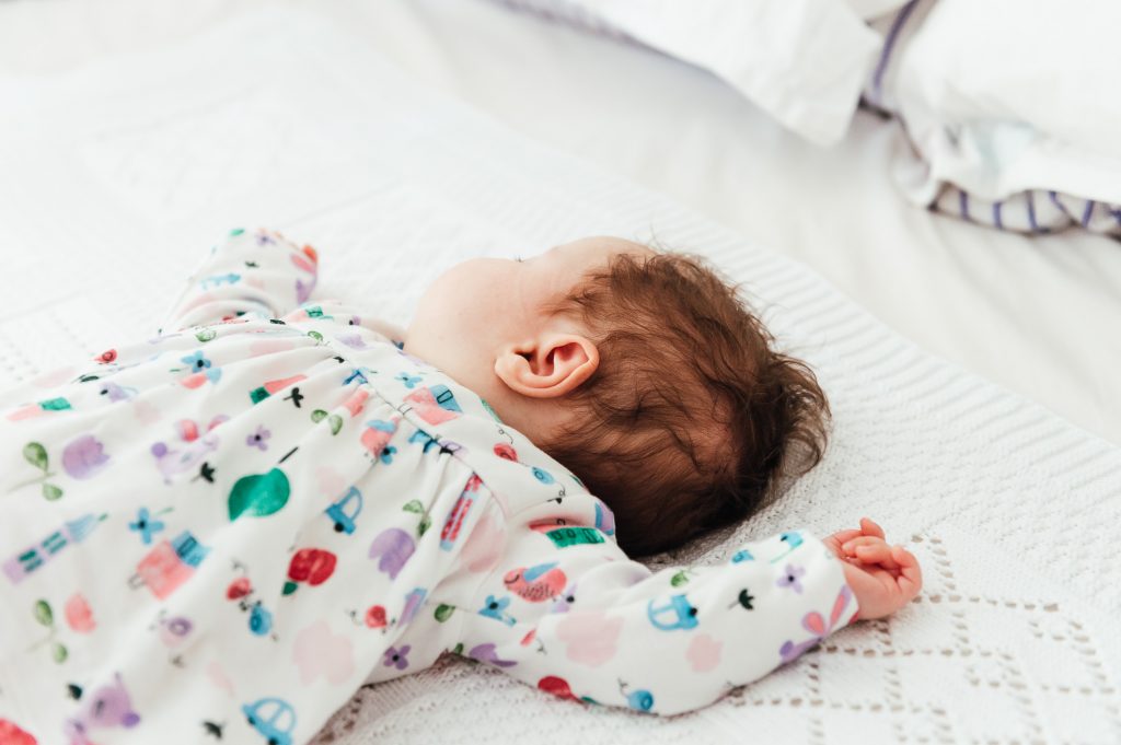 Sleeping baby in a relaxed newborn photography shoot