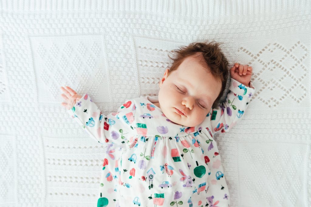 Sleeping baby in a relaxed newborn photography shoot