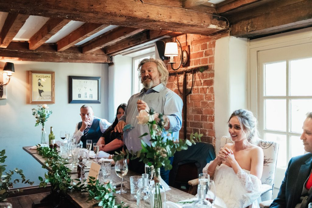 Father of the bride holds a speech at the wedding breakfast