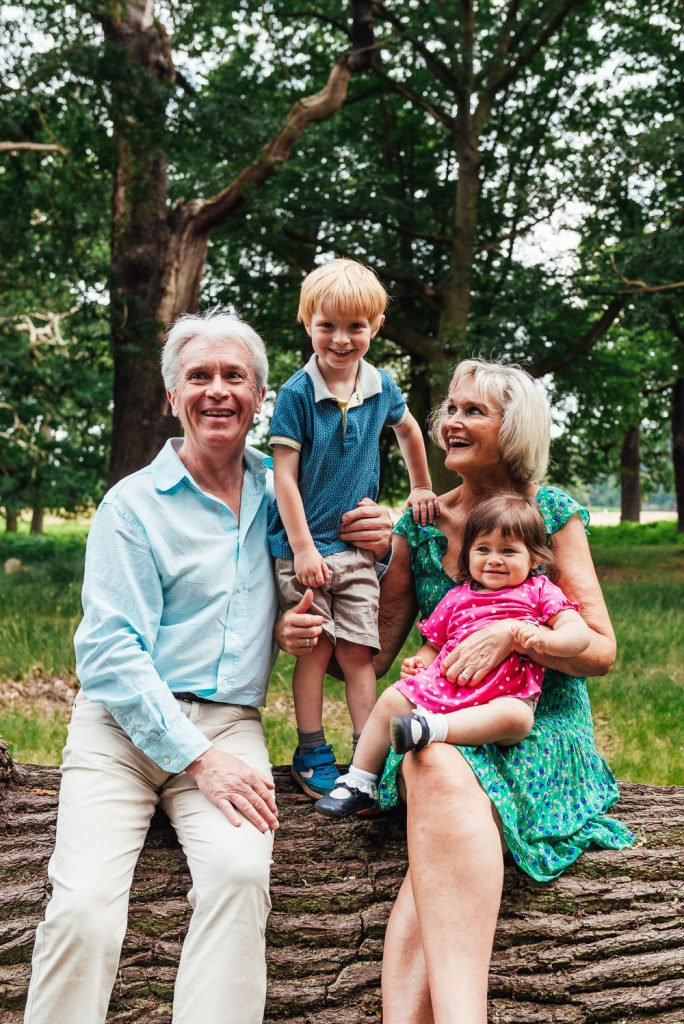 Fun and natural portrait of grandparents and grandchildren 