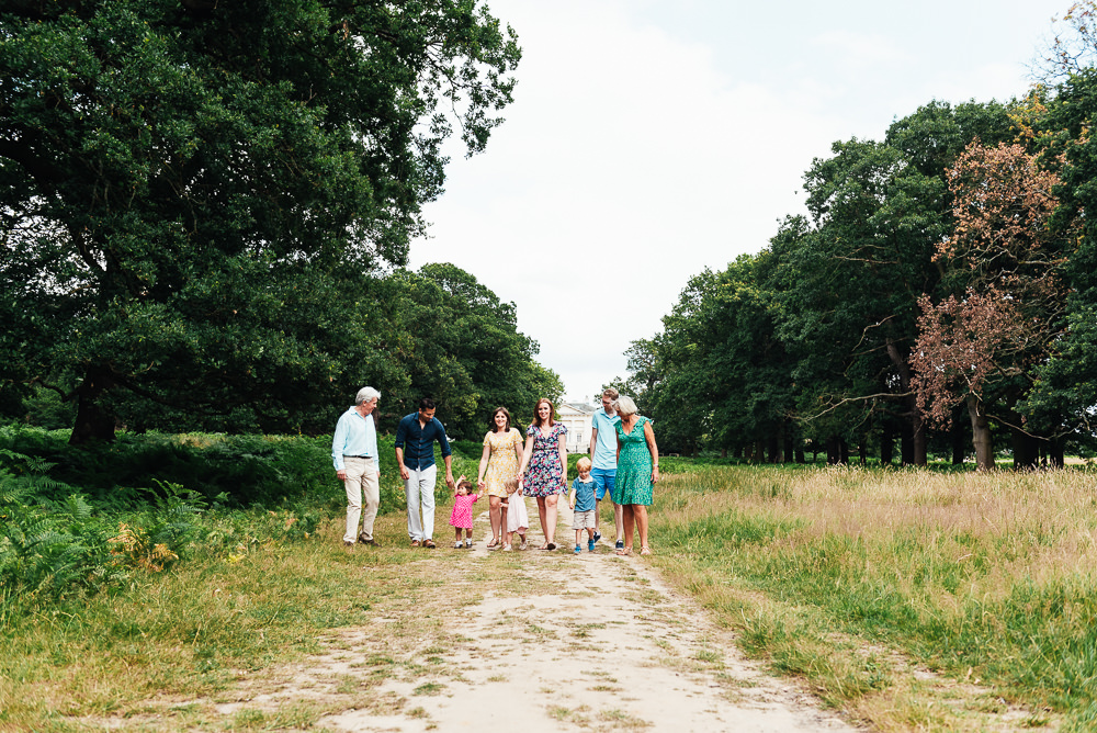 Family walk together in Richmond Park