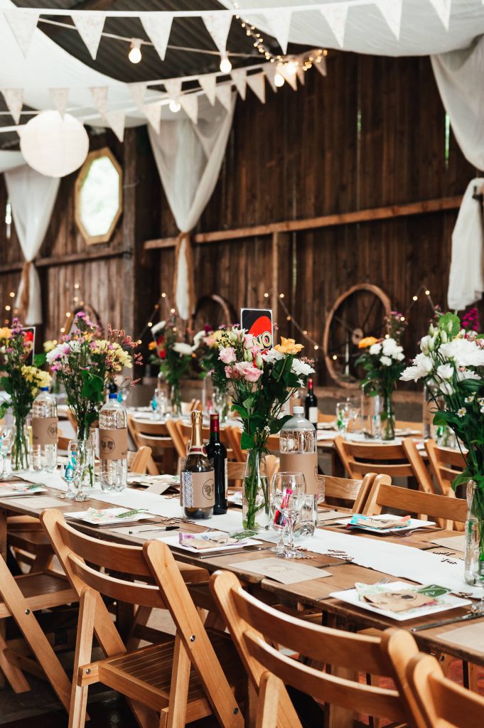 Rustic barn wedding adorned with wild flower bouquets