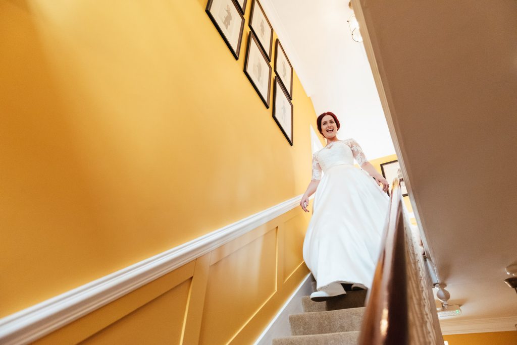 Bride makes her entrance in her dress for the first time