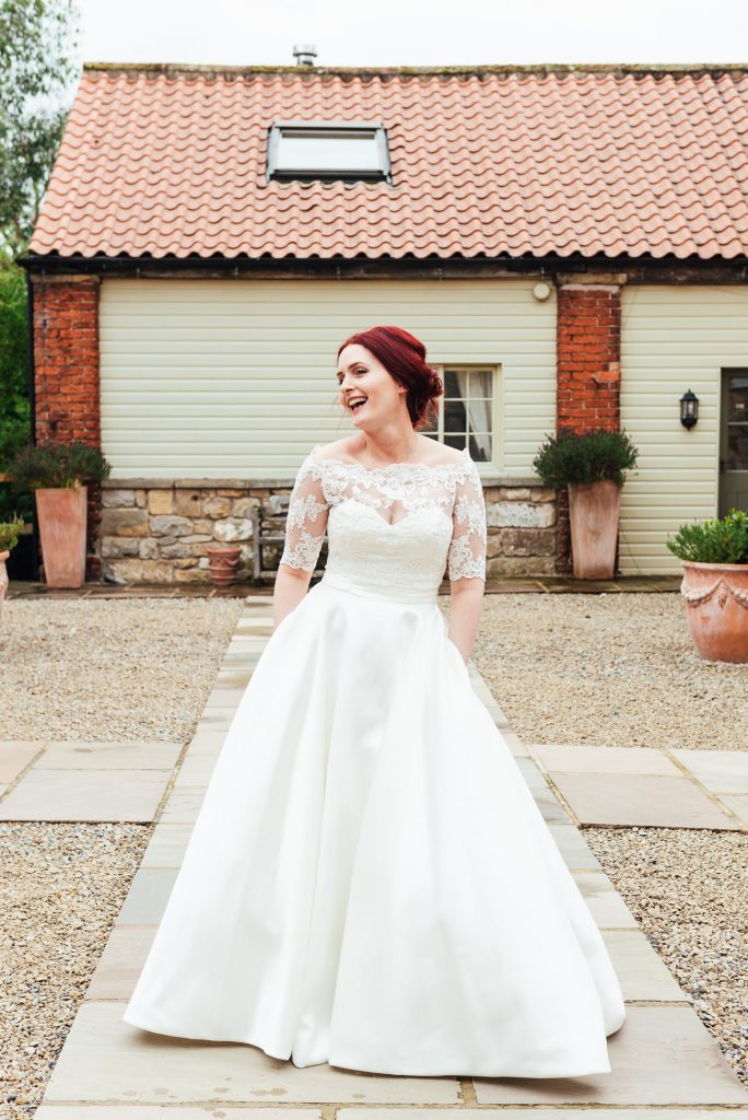 Gorgeous bride in a strapless gown with bespoke pockets