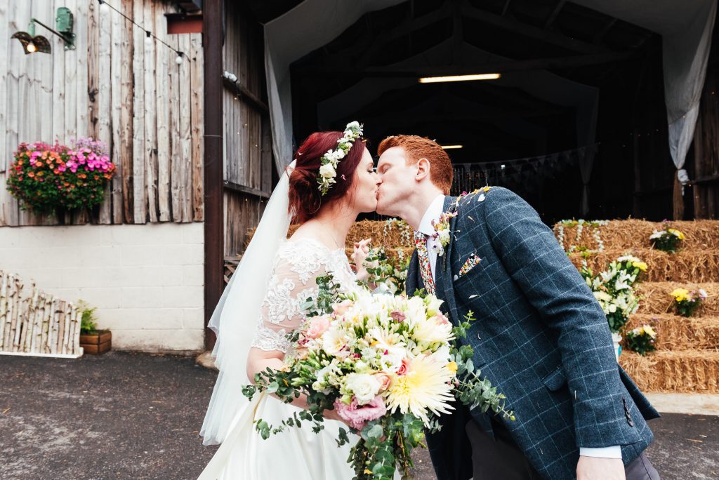 Couple kiss after ceremony, Deepdale Farm wedding