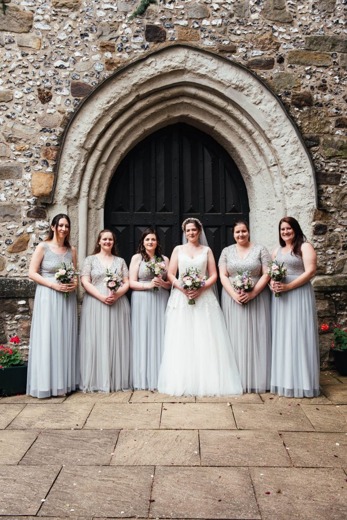 Bridesmaid wedding portrait with pale grey dresses and pastel wedding bouquets