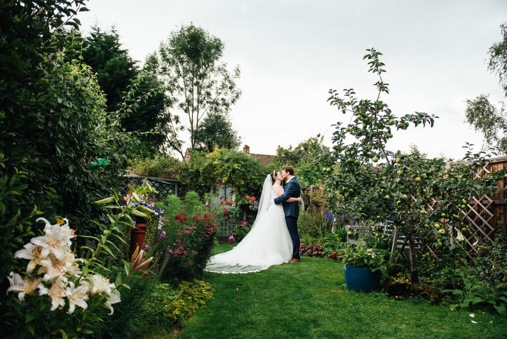 Beautiful English garden for bride and groom wedding portraits