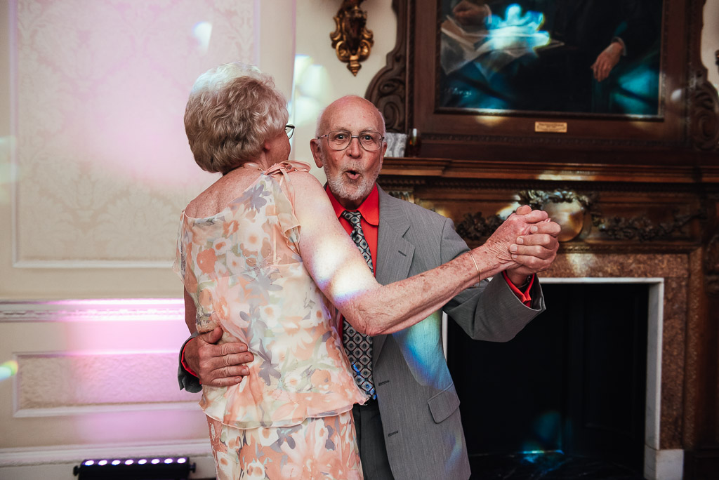 elderly couple dance together