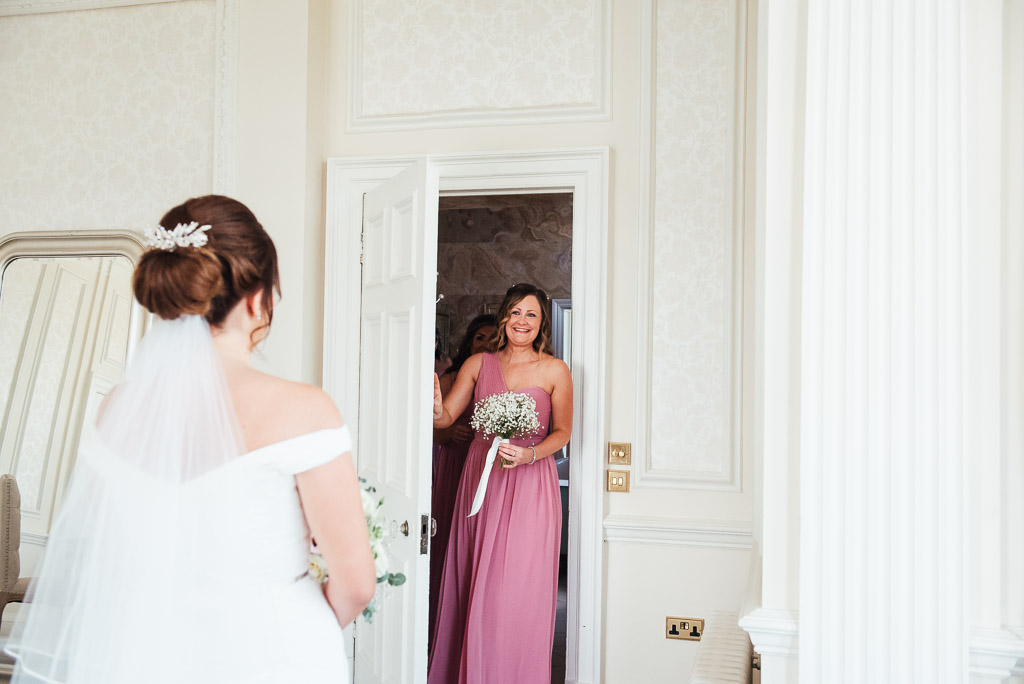First look of the beautiful bride from her bridesmaids
