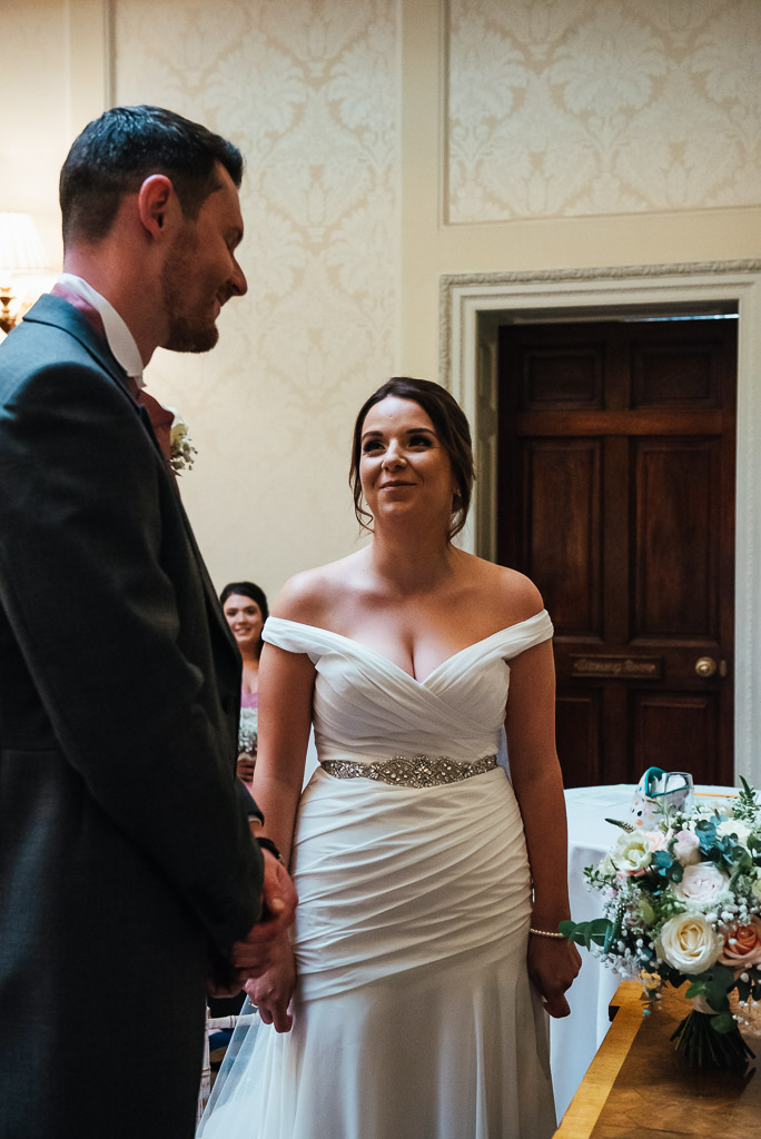 Beautiful bride looks at her husband to be