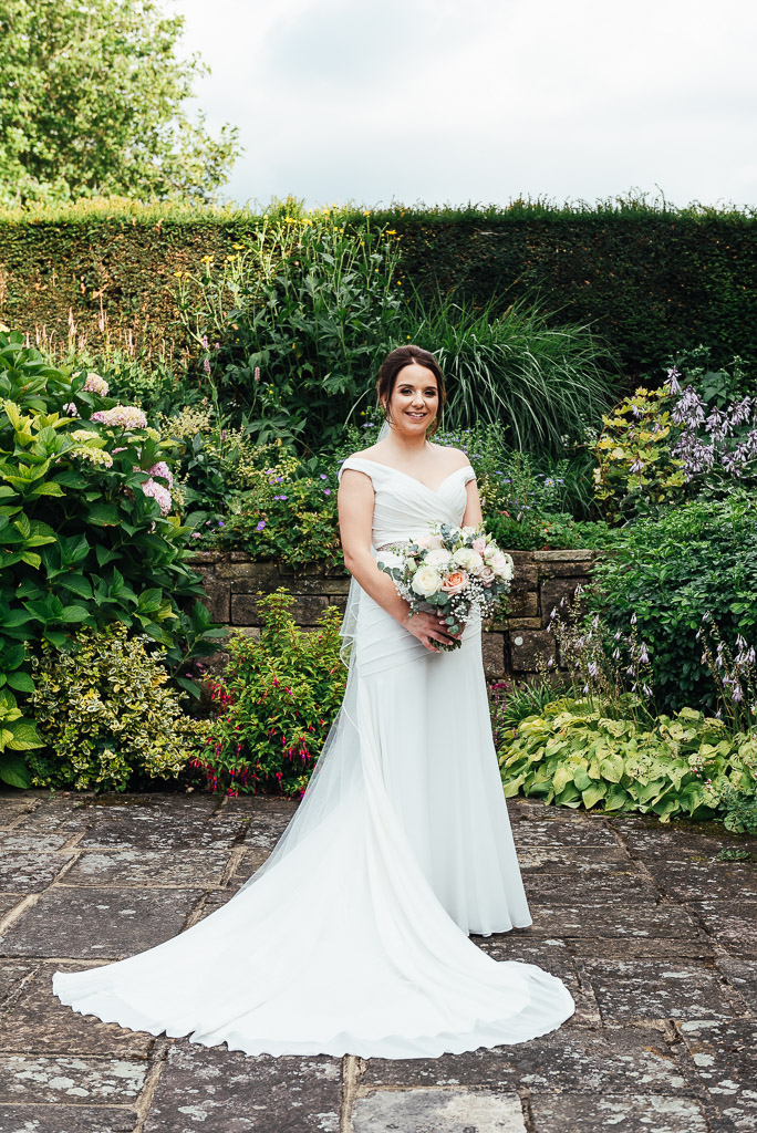 Classic and elegant bride in an off the shoulder wedding dress