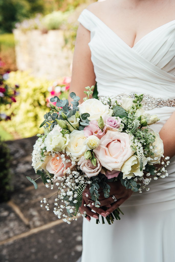Beautiful bridal bouquet of gypsophila, pink roses and eucalyptus 