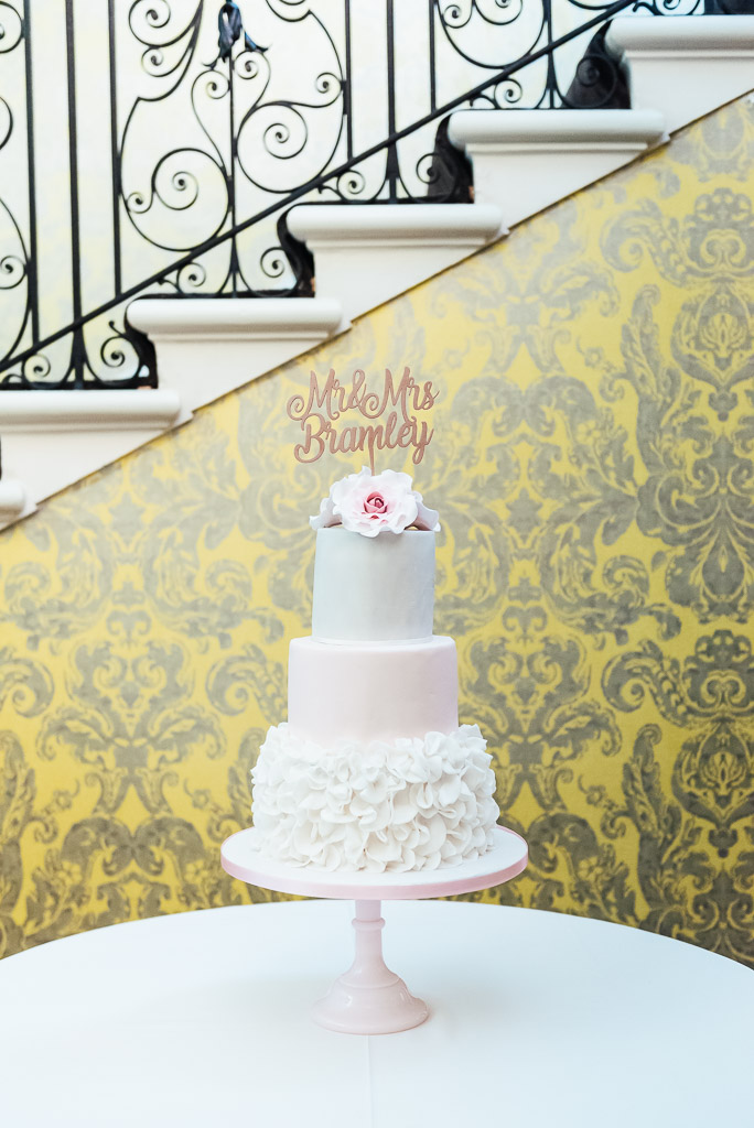 Pretty pink three tiered layered wedding cake