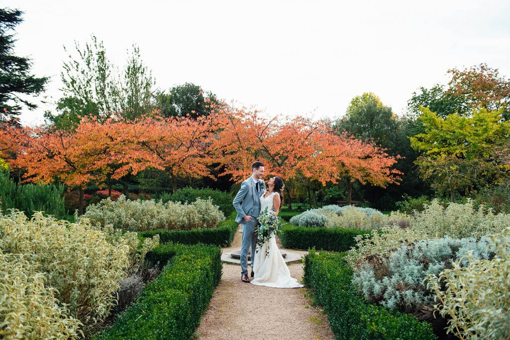 Creative couples portrait at Forty Hall with autumnal leaves