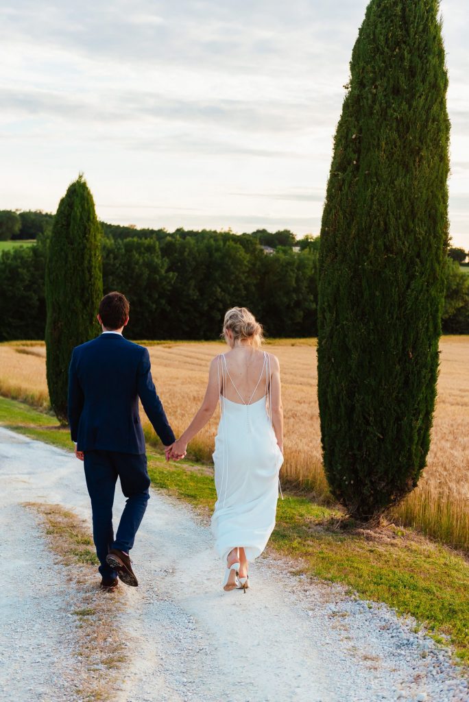 Couple walk together int he Parisian sunset, destination wedding photography