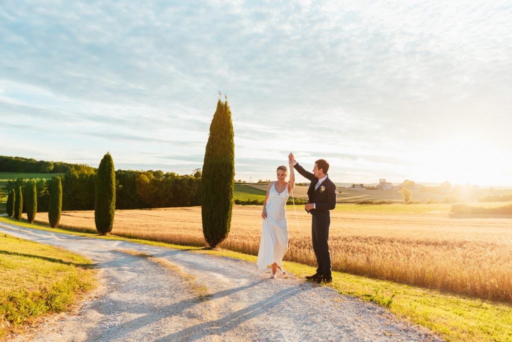 Couple dance in the French countryside at sunset