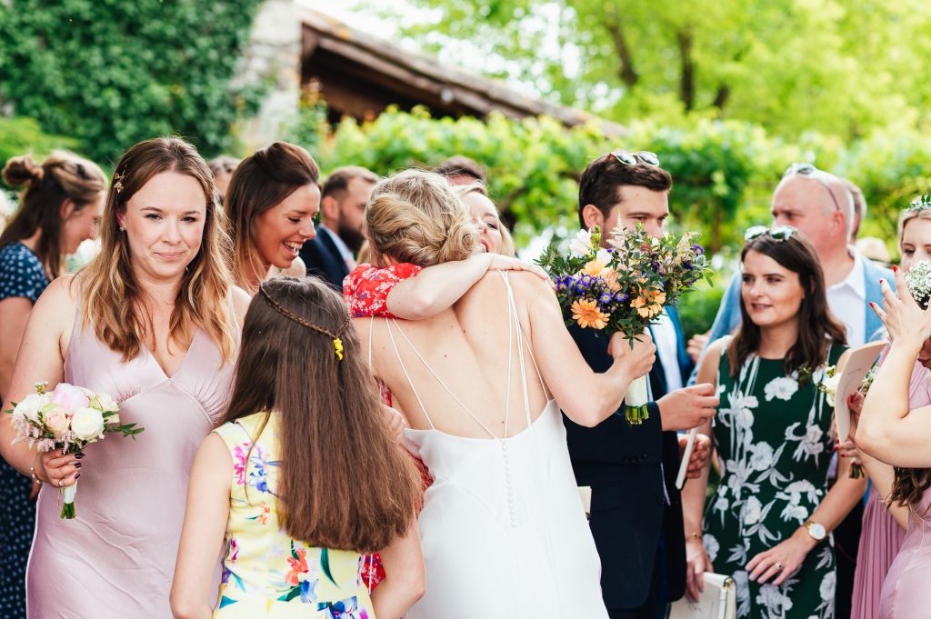 Congratulatory hugs for the newly married couple, destination wedding photography