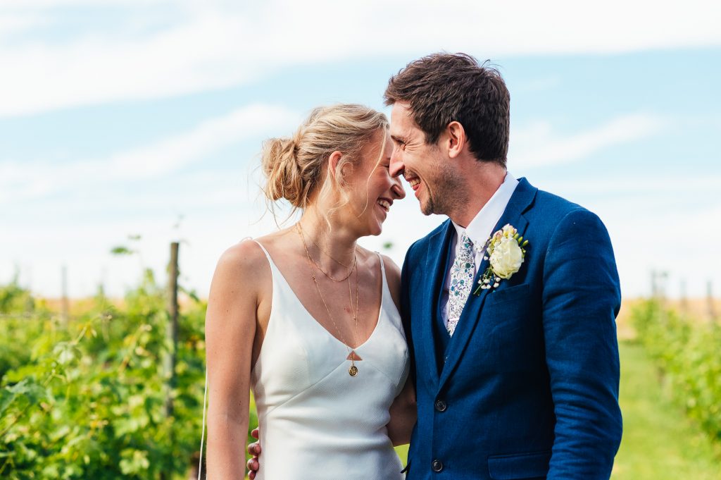 Natural and relaxed wedding portrait surrounded by French vineyards