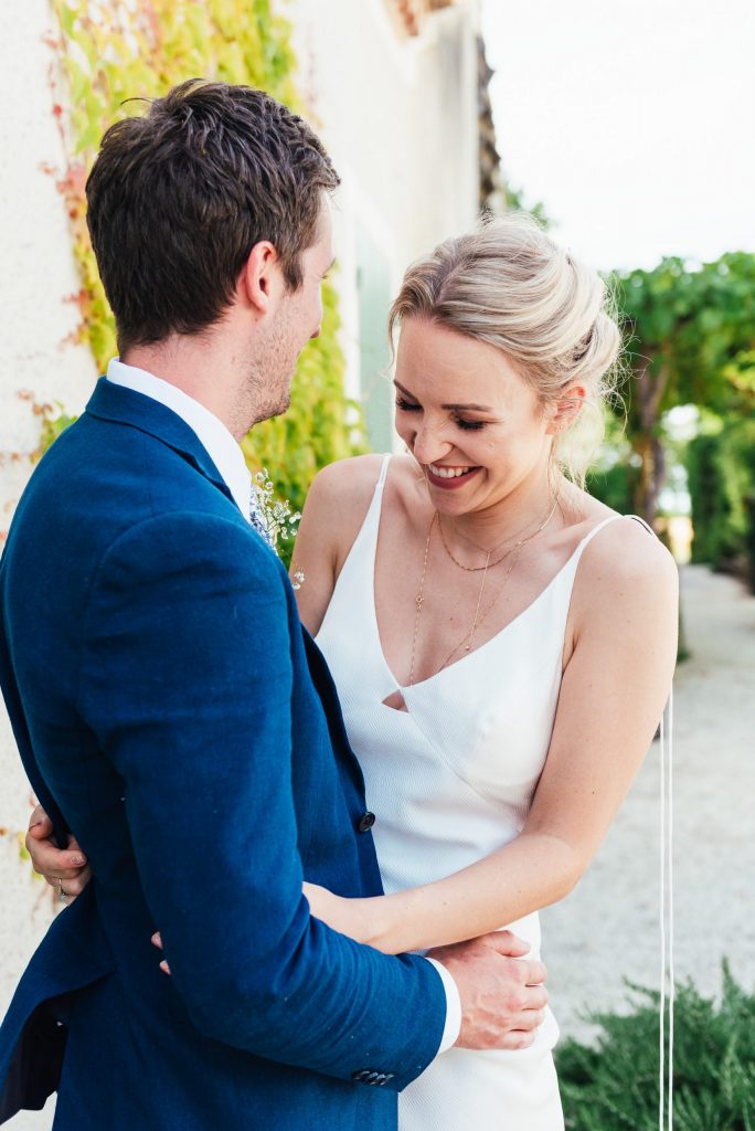 Natural couples portrait with giggling bride