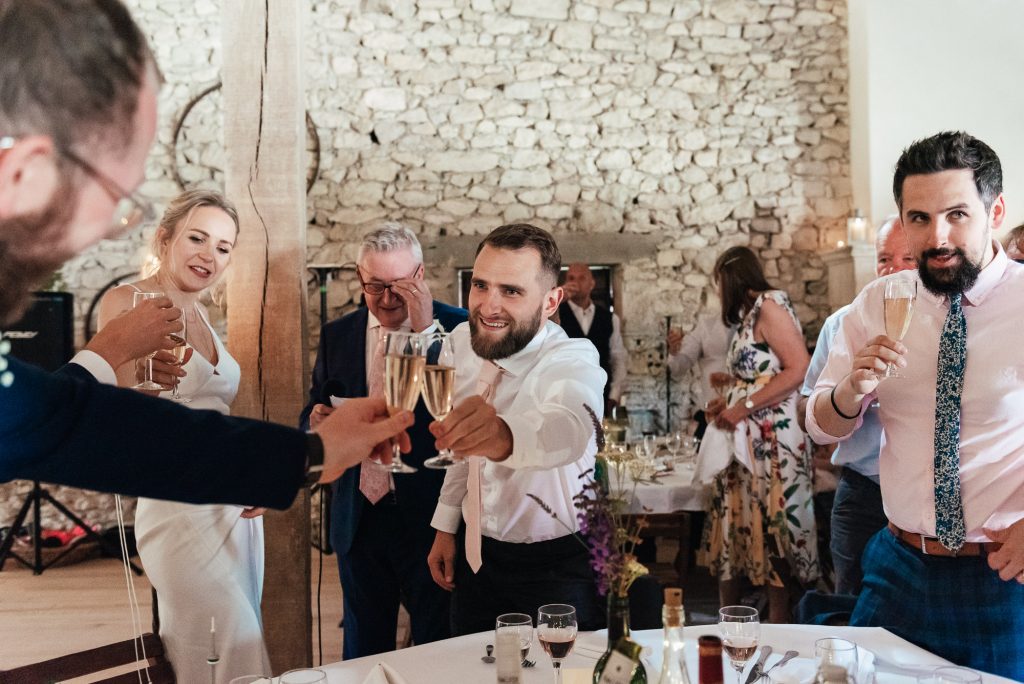 During Wedding speeches guests cheers together