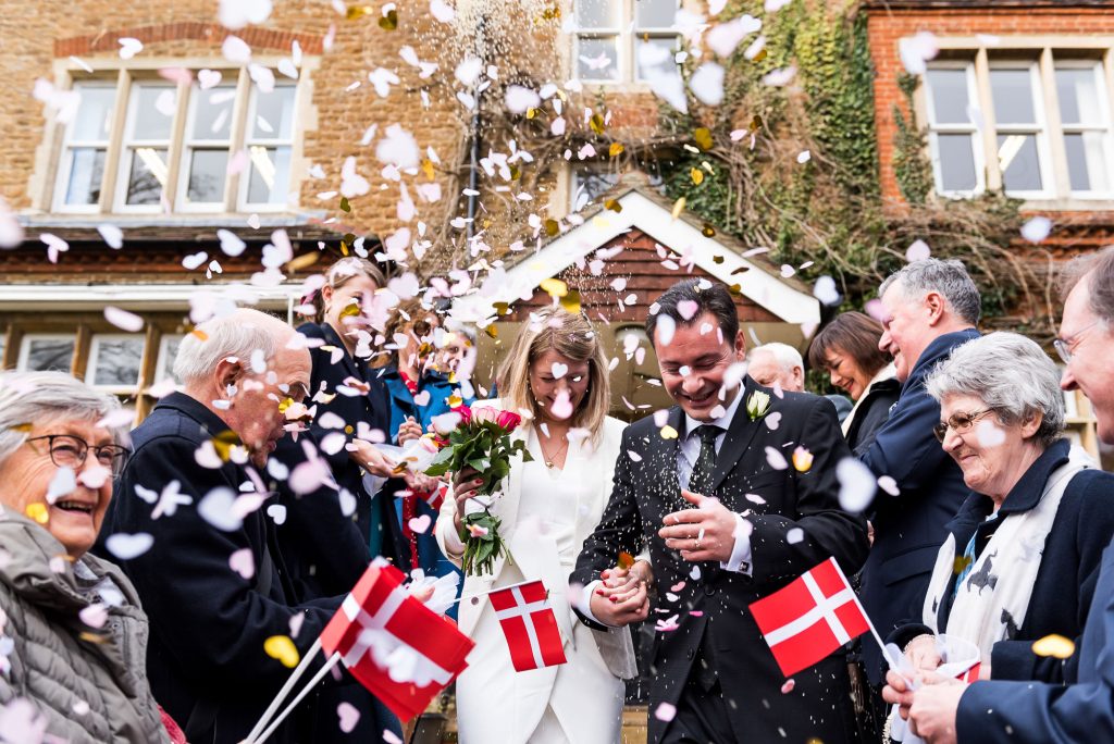 Danish couple run through their confetti line together 