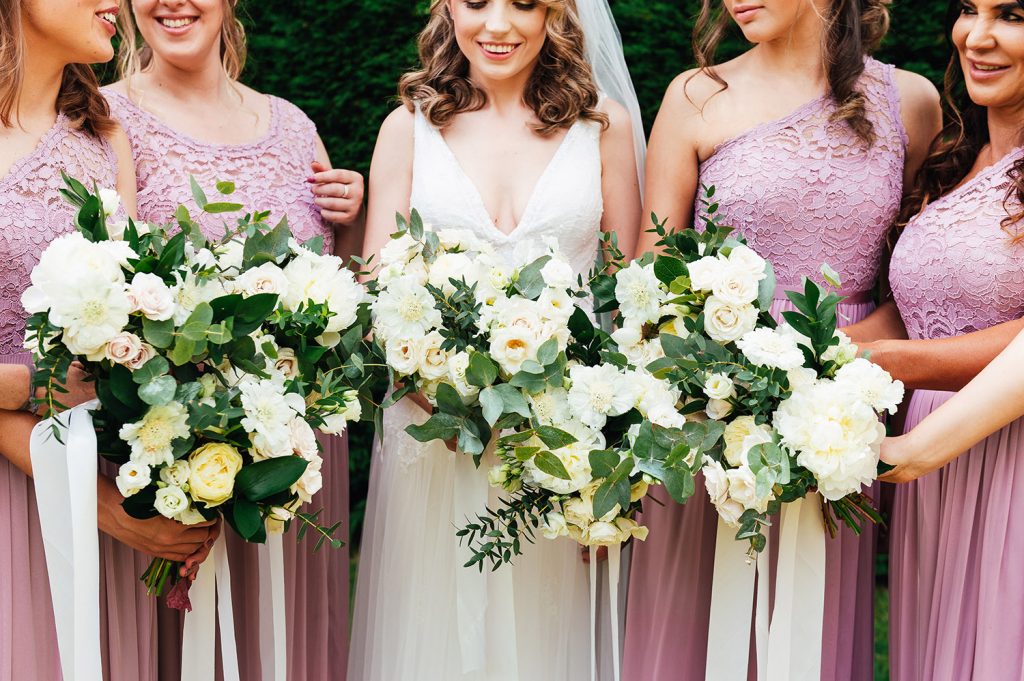 Natural bridesmaid group photograph with matching wedding bouquets