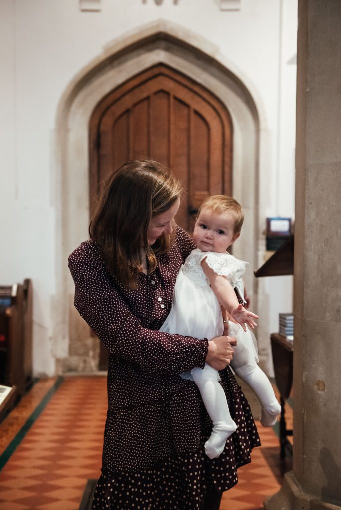 Mother and baby in relaxed christening photography