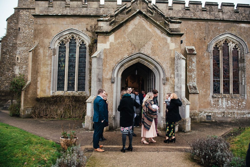 Guests gather outside church after ceremony