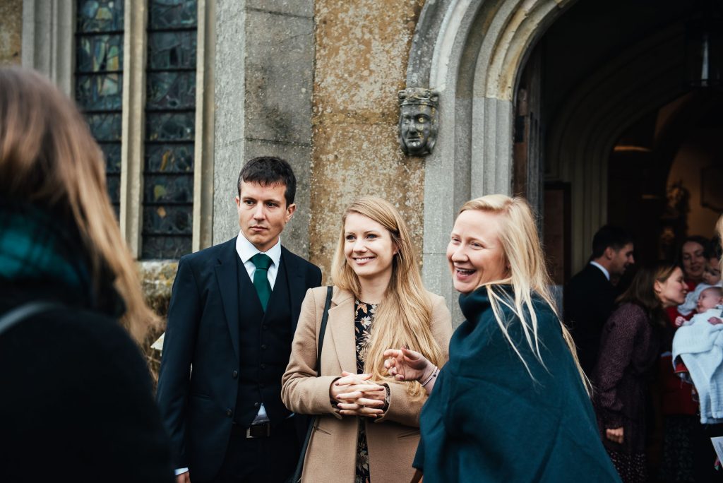 Guests gather outside church after ceremony
