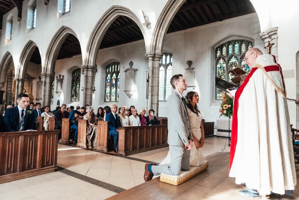Vicar offers a blessing to the newly married couple
