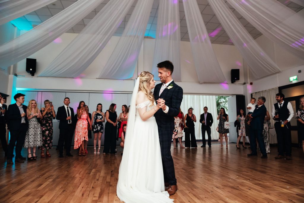Bride and groom share a romantic first dance together