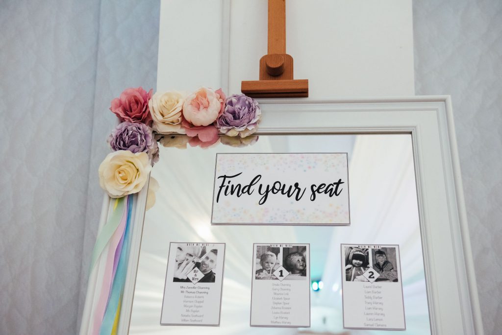 Handmade seating chart with mirror back ground