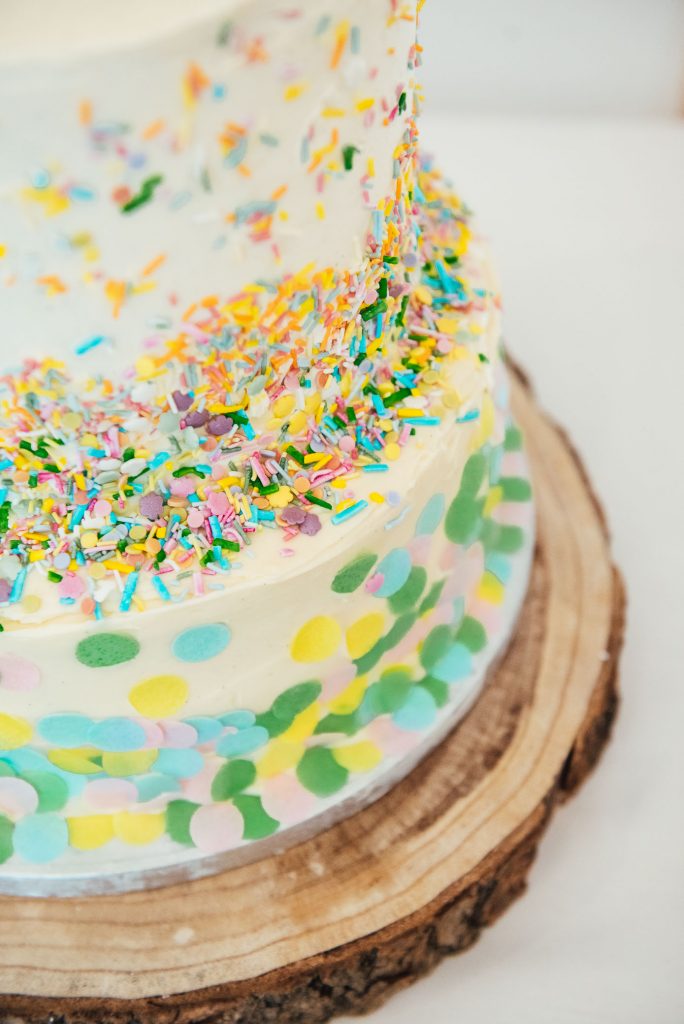 Three tier homemade wedding cake with confetti decoration