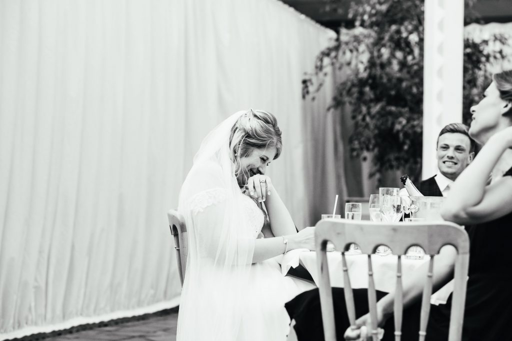 Emotional bride takes a moment during wedding speeches