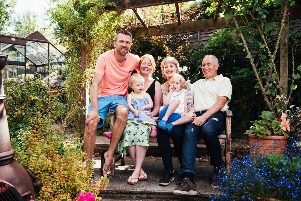 Natural family portrait at home in the garden