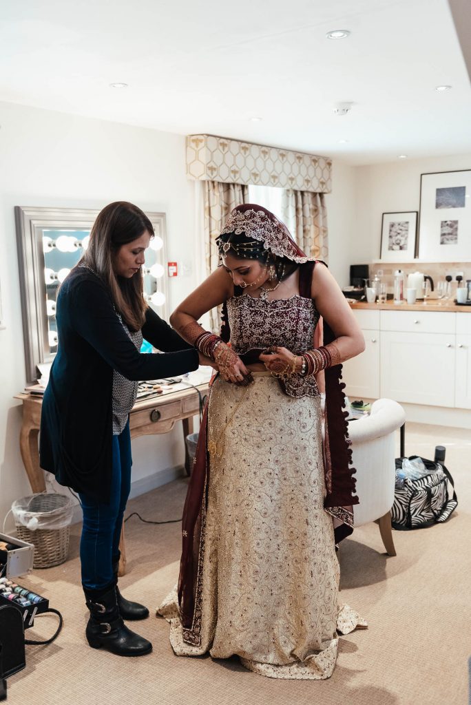 Final preparations for Indian bride on wedding day morning