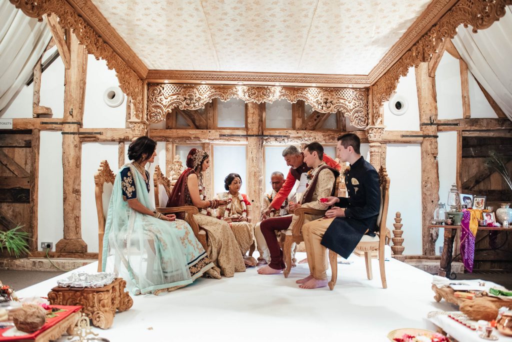 Wedding party sit under the Mandap, Hindu wedding ceremony