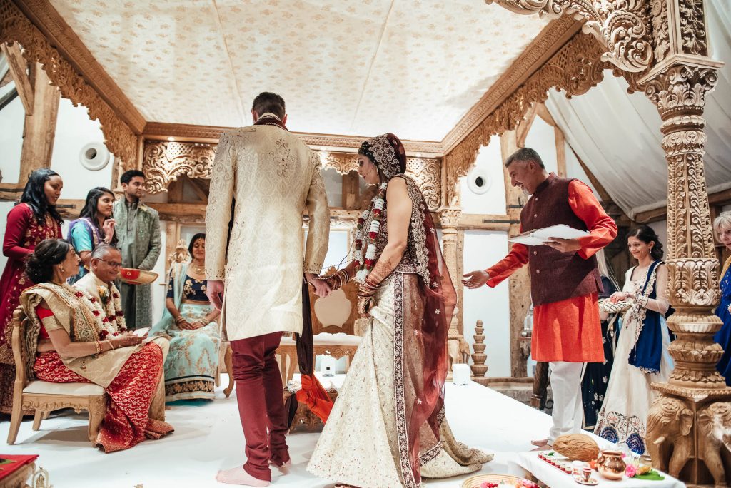 Bride and groom pass around the fire during Hindu wedding ceremony