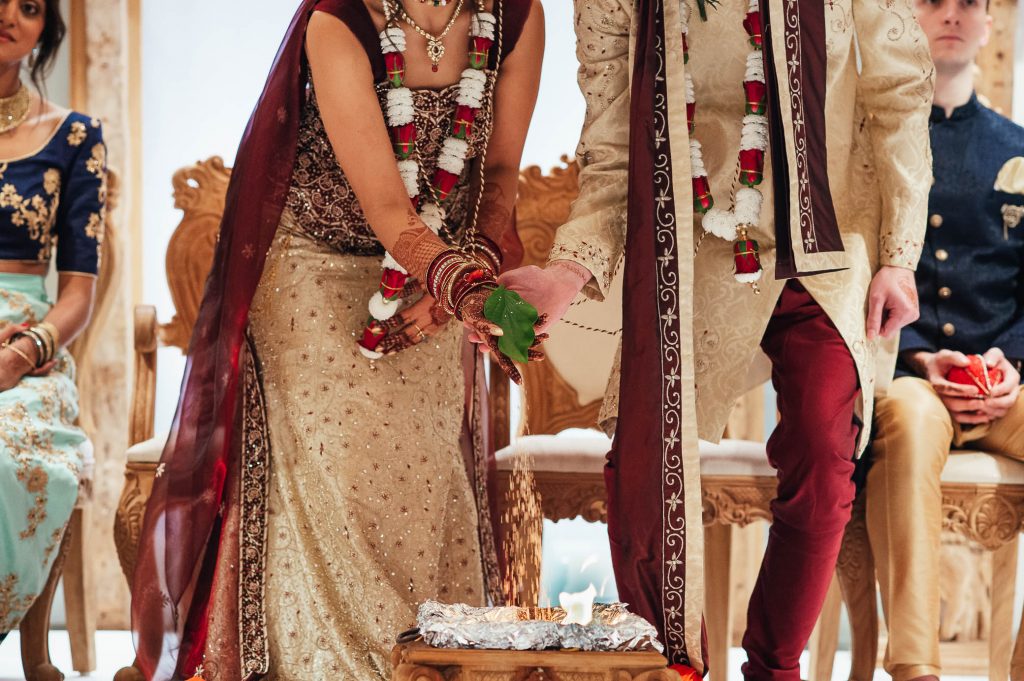 Bride and groom perform sacrificial fire ritual, Hindu South Farm wedding