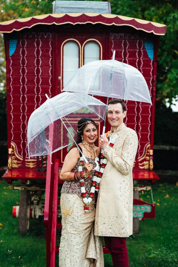 Relaxed wedding day portraits with vintage caravan background