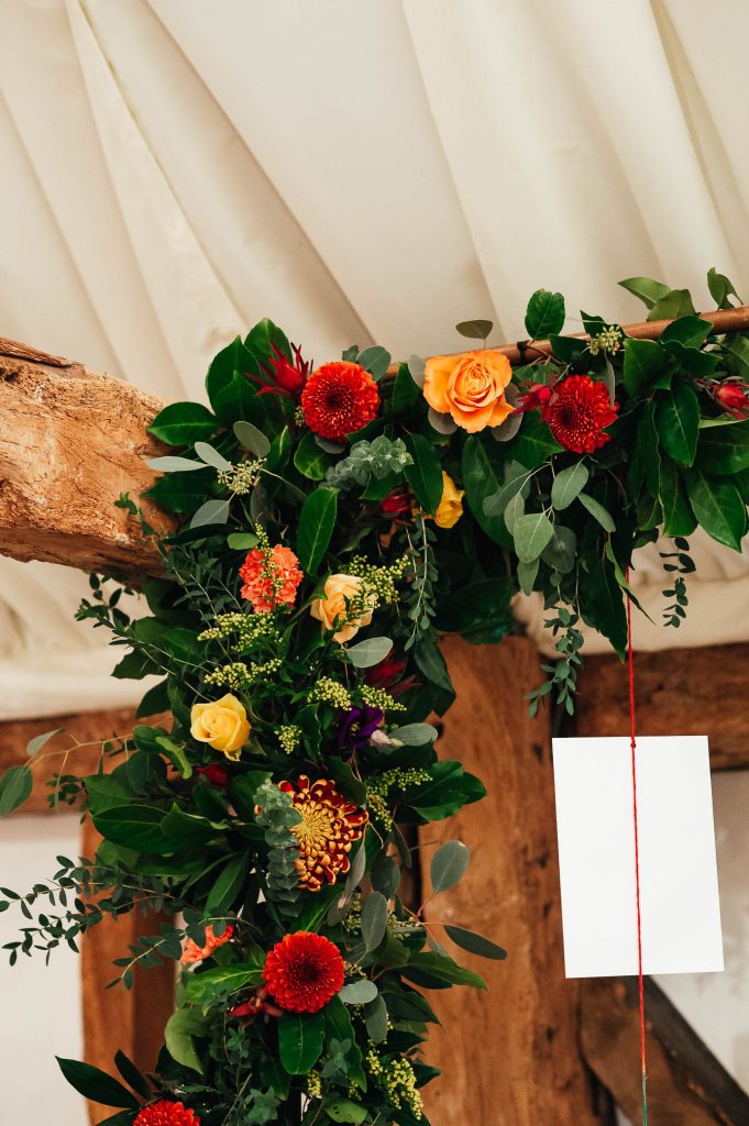 Wedding table setting flower arch