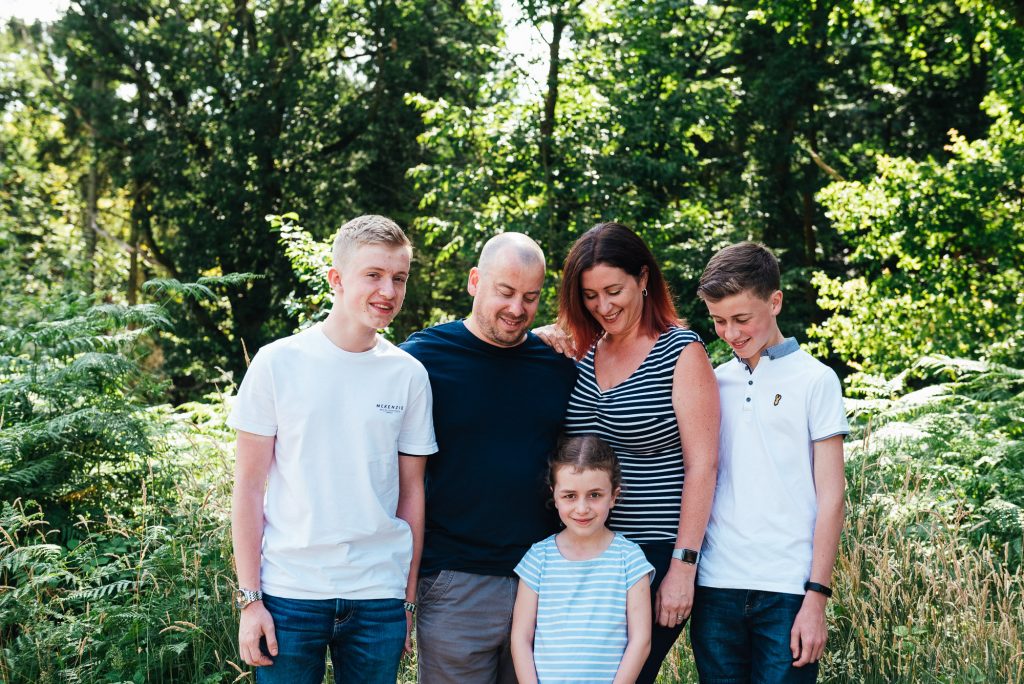 Candid family portrait at Chantry Woodland