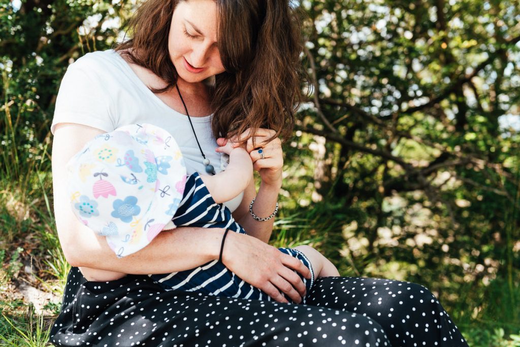 Natural and relaxed portrait of mother and baby breastfeeding