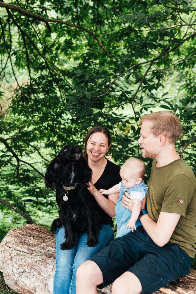 Outdoor newborn photography with pet dog