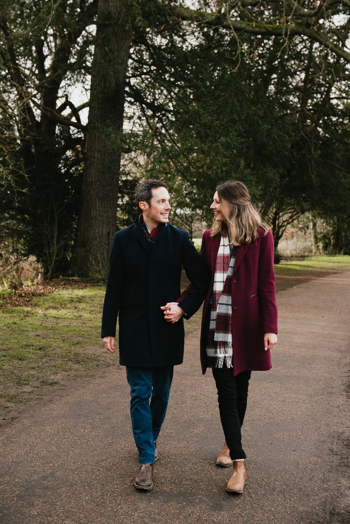 Couple walk together in Painshill Park