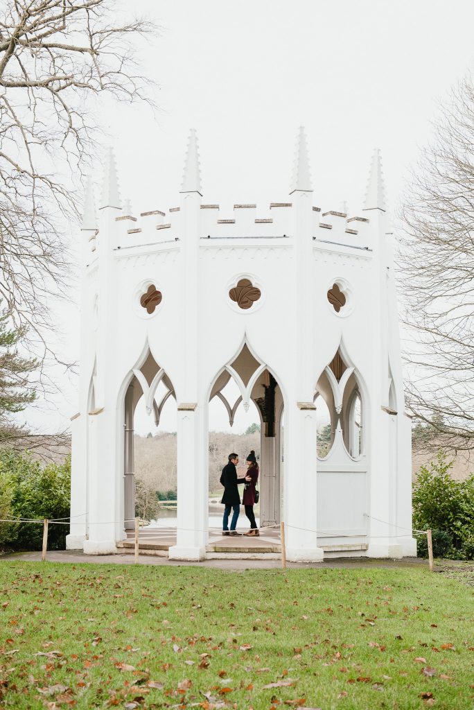 Couple Stand together in The Gothic Tower at Painshill Park