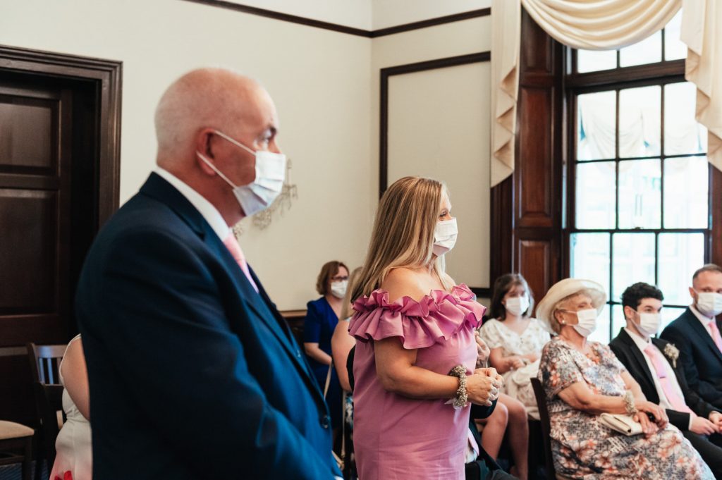 Guests Wear Masks During The Ceremony