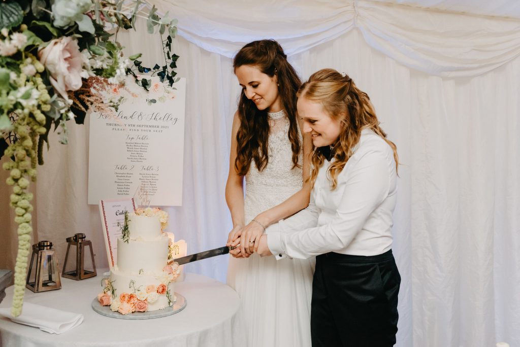 Bride and Bride Cut the Cake, relaxed LGBT Wedding Photography